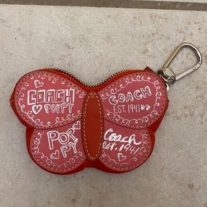 Small butterfly coach change purse.